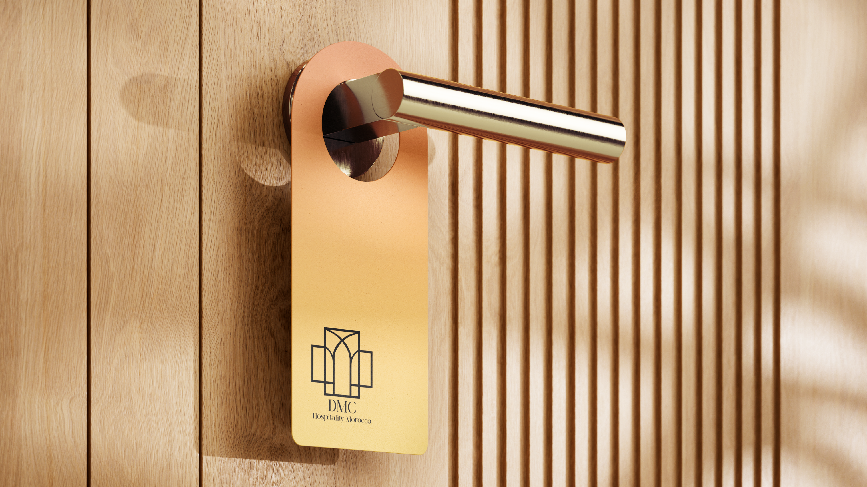 DMC Hospitality Morocco logo on door hanger